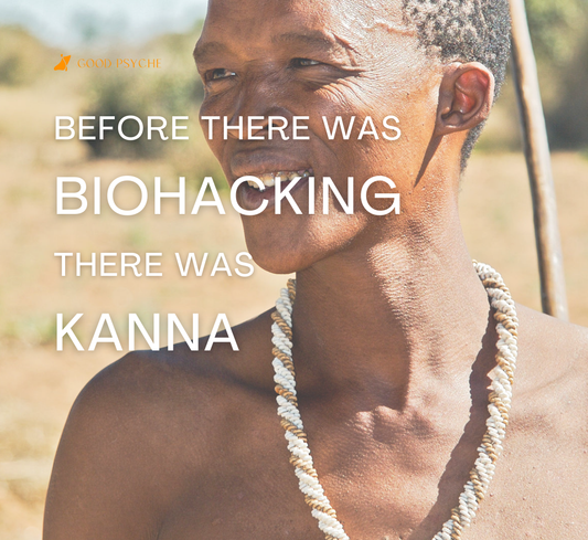 A member of the Khoisan tribe in traditional attire, standing in a desert landscape.