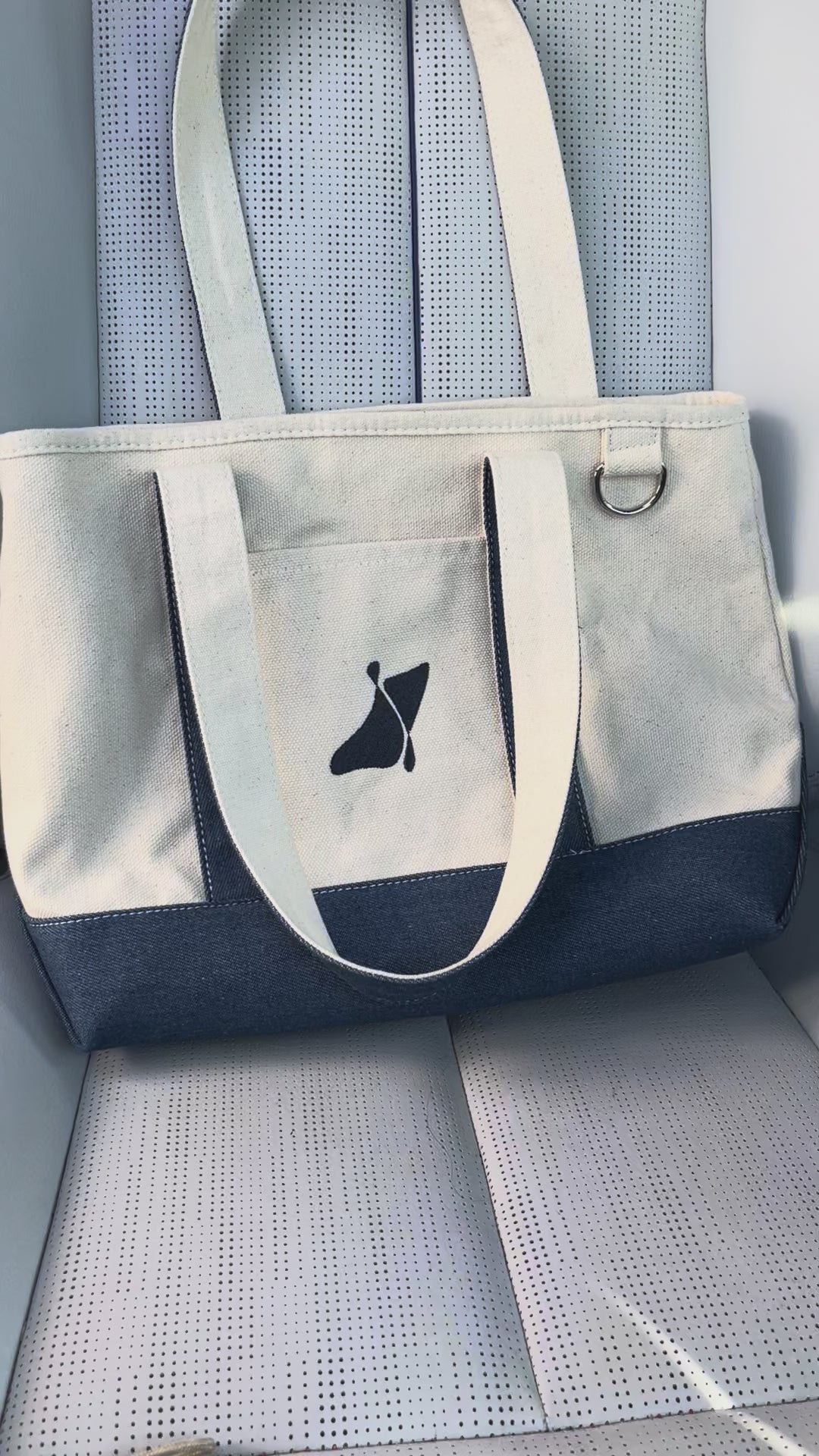 Placing the Good Psyche magazine inside the east coast tote bag